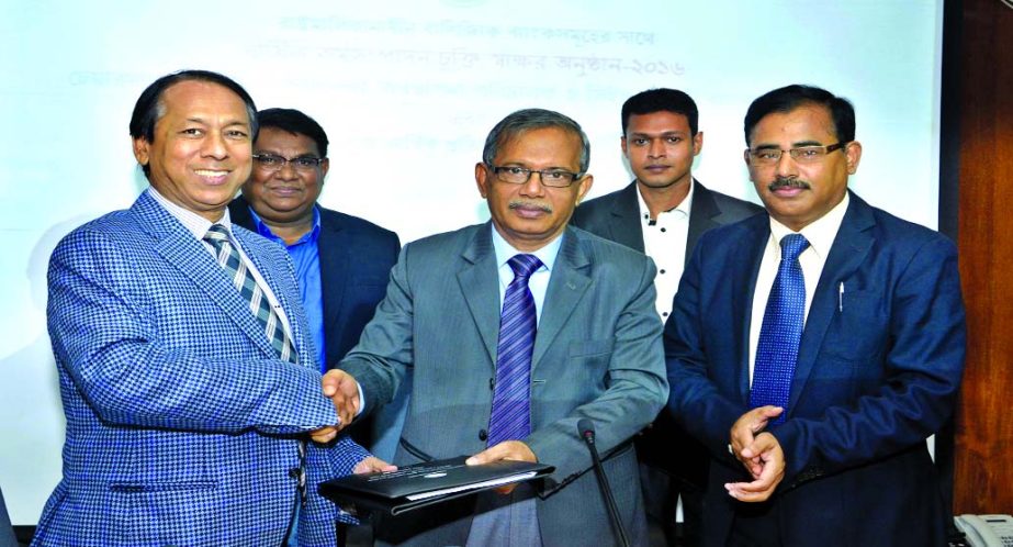 Md Eunusur Rahman, Secretary of Bank and Financial Institutions Division of the Ministry of Finance and Md Ataur Rahman Prodhan, Managing Director and CEO of Rupali Bank Ltd (RBL) exchange documents after signing an Annual Performance Agreement 2016-2017