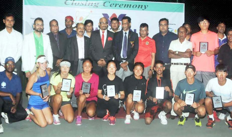 Prize winners of the Walton 30th Bangladesh ITF Junior Tennis Championship with the guests pose for photo at the Ramna National Tennis Complex here Saturday.