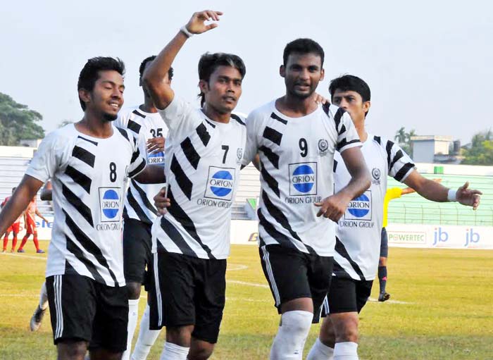 Players of Mohammedan Sporting Club Limited celebrate after scoring a goal during JB Bangladesh Premier League football match against Soccer Club Feni at Mymensingh Stadium on Saturday.