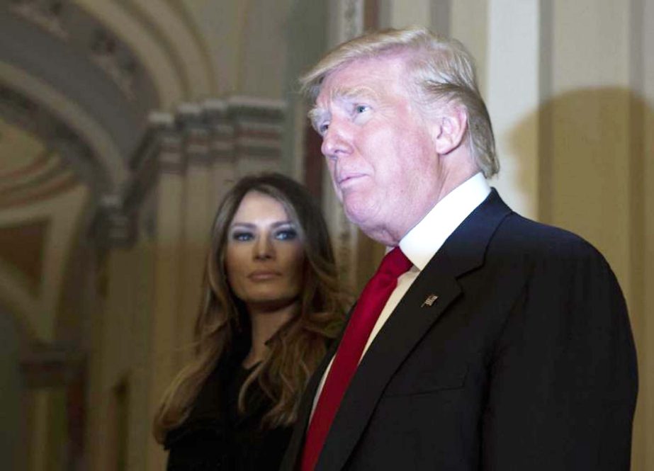 President-elect Donald Trump, accompanied by his wife Melania, speaks to the media on Capitol Hill in Washington following a meeting with Senate Majority Leader Mitch McConnell.