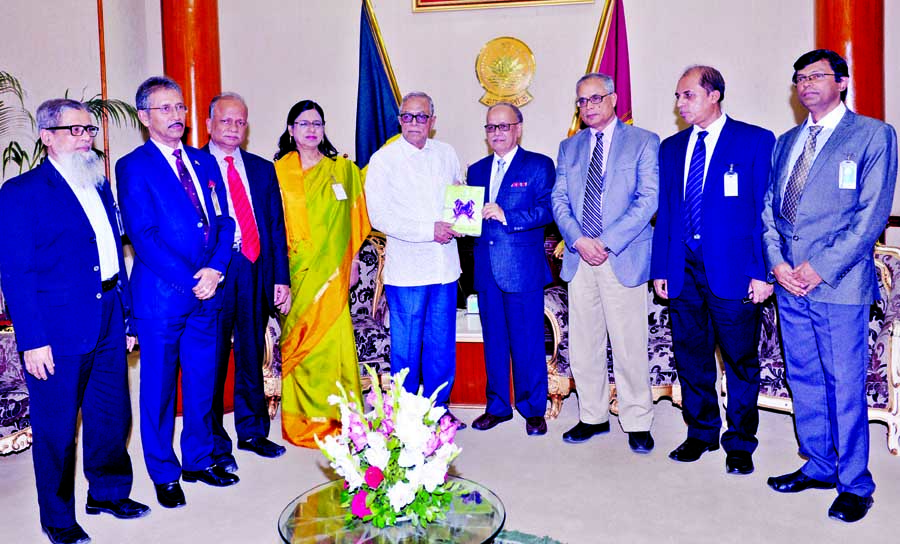 University Grants Commission Chairman Prof Abdul Mannan submitting its annual report-2015 to President Abdul Hamid at Bangabhaban on Monday. Press Wing, Bangabhaban photo