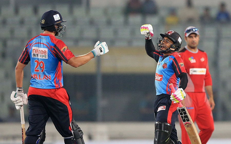 Dawid Malan (L) and Mushfiqur Rahim celebrate after Barisal Bulls win during the Bangladesh Premier League match against Chittagong Viking at Sher-e-Bangla National Cricket Stadium in Mirpur on Monday.