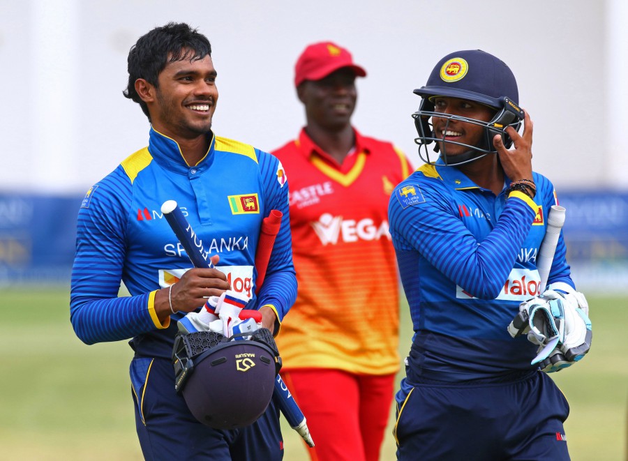 Dhananjaya de Silva and Kusal Mendis walk off after securing Sri Lanka's win against Zimbabwe in tri-series 2016-17 at Harare on Monday. Sri Lanka won by 8 wickets with 153 balls remaining.