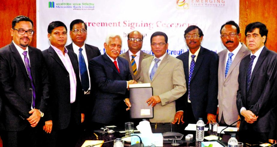Kazi Masihur Rahman, Managing Director and CEO of Mercantile Bank Limited (MBL) and N.K.A Mobin, FCA, FCS, Managing Director and CEO of Emerging Credit Rating Limited (ECRL) exchanging documents after signing a deal in the city on Monday. Under the agreem
