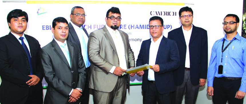 M. Nazeem A. Choudhury, Head of Consumer Banking of Eastern Bank Limited (EBL) and Morshedul M. Murad Hassan, Chief Executive Officer of Camerich Furniture exchange documents after signing a Zero percent installment plan (ZIP) agreement in the city recent