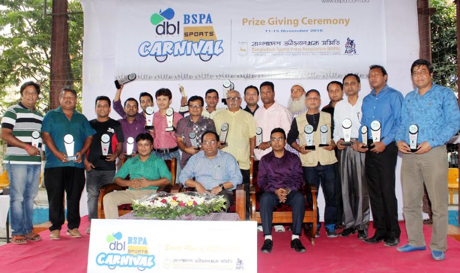 The winners of the DBL-BSPA Sports Carnival with the chief guest Secretary of National Sports Council Ashok Kumar Biswas and the officials of Bangladesh Sports Press Association (BSPA) pose for a photo session at the Shaheed (Captain) M Mansur Ali Nationa