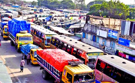 Ferry service between Paturia and Daulatdia were suspended due to poor navigability on Tuesday resulting in long queues of vehicles on both sides of the river. Photo shows hundreds of vehicles waiting in lines for several hours to get across the river.