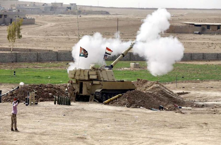 The Iraqi army fires a 155mm shell towards Islamic State militant positions in Mosul from the village of Ali Rash, east of Mosul on Tuesday.
