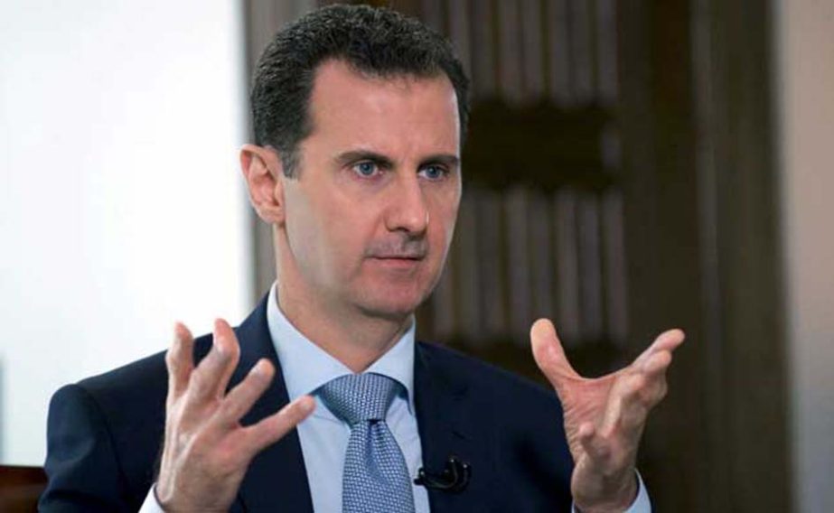 Syrian President Bashar al-Assad addressing newsmen in Damascus.