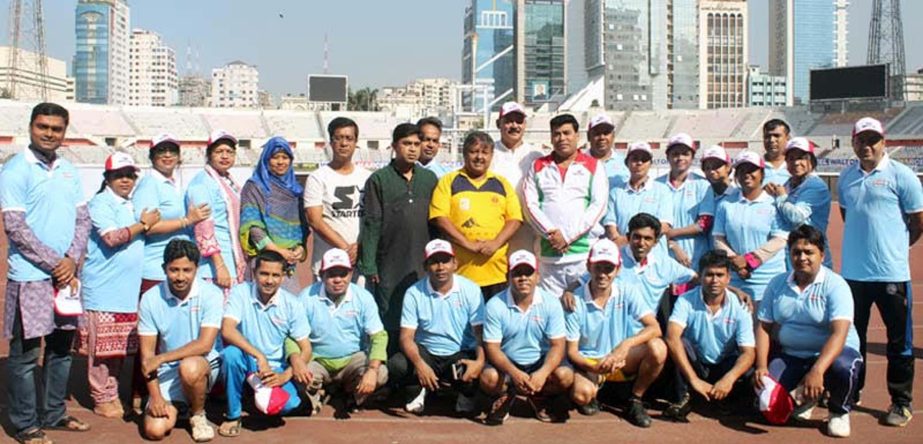 The participants of the Marcel-DRU Athletics Competition and the guests and officials of Dhaka Reporters Unity (DRU) pose for a photo session at the Bangabandhu National Stadium on Friday.