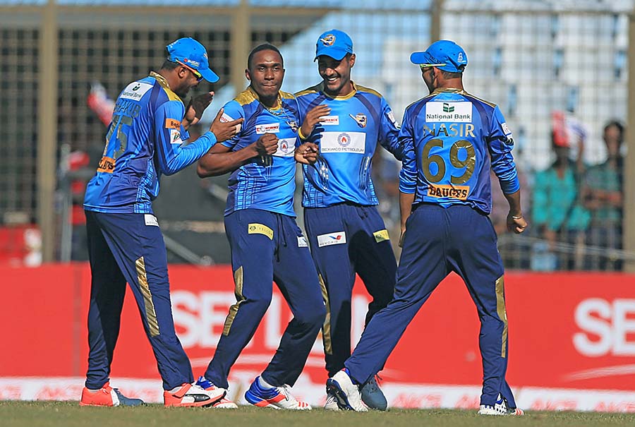 Dwayne Bravo celebrates with teammates after taking a wicket during the AKS Bangladesh Premier League T20 match between Dhaka Dynamites and Khulna Titans at the Zahur Ahmed Chowdhury Stadium in Chittagong on Saturday.