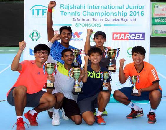 All champions and runners-up of International Junior Tennis Championship pose for photo with their trophies at the Zafor Imam Tennis Complex in Rajshahi on Saturday.