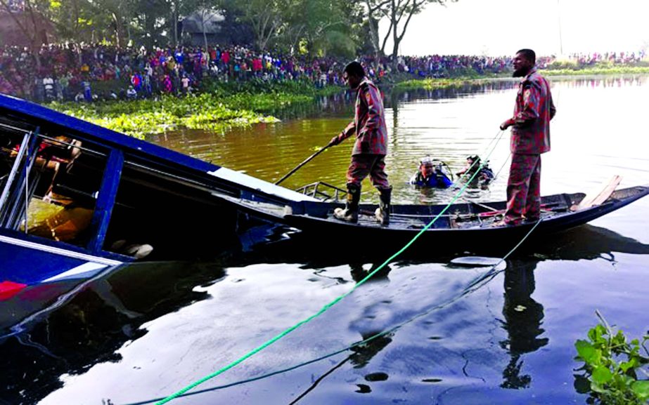 Rescuers found two dead bodies as a passenger bus skidded into a road side canal at Kalkini Upazila in Madaripur on Saturday.