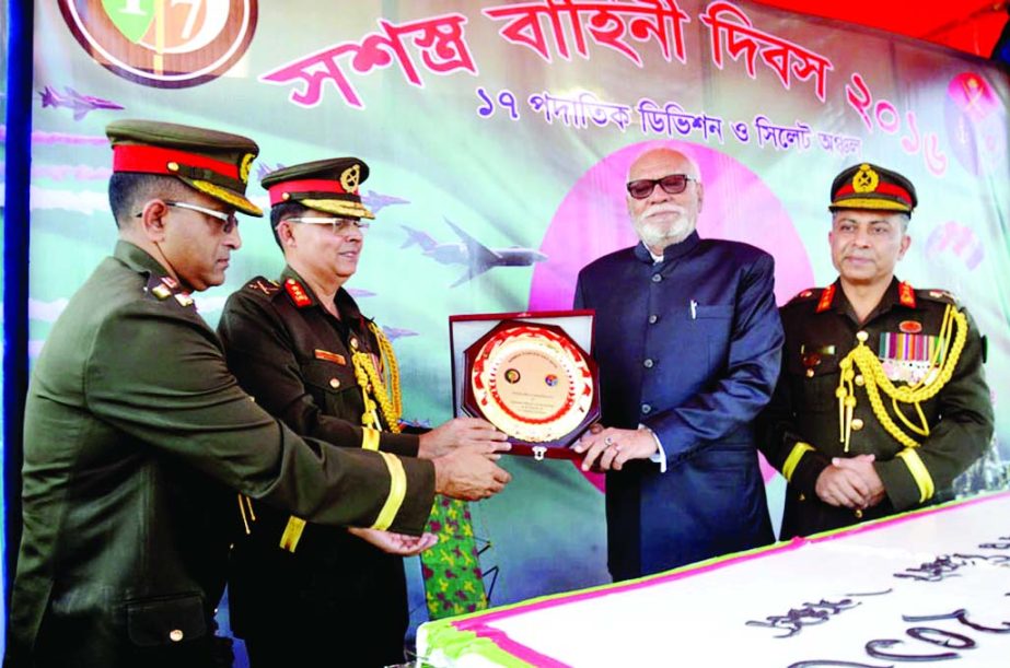 SYLHET: Land Minister Shamsur-Rahman Sharif receiving crest from the high officials of 17th Infantry Division of Bangladesh Army at Sylhet Cantonment on the occasion of the Armed Forces Day on Monday.