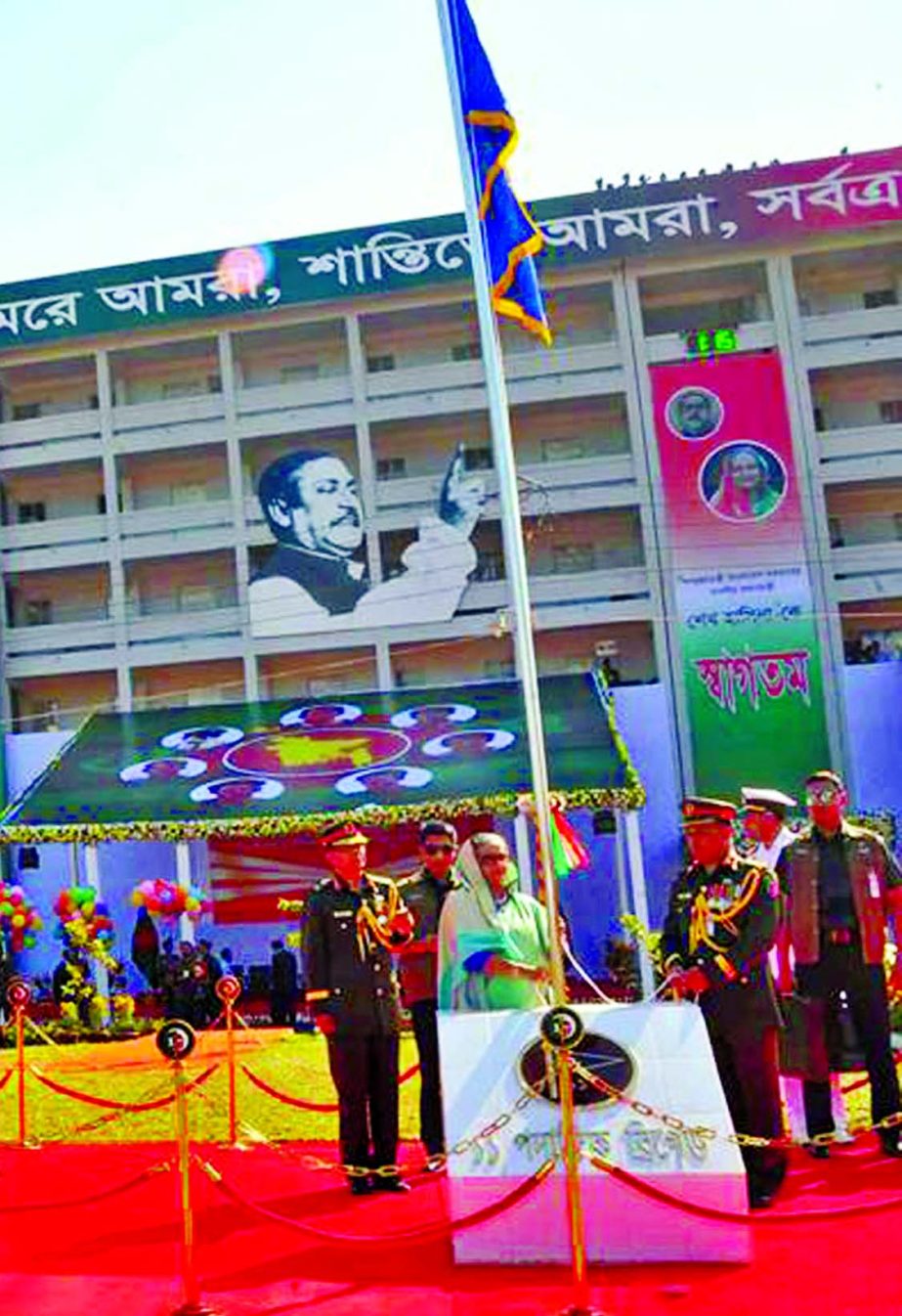 Prime Minister Sheikh Hasina raising flags of nine units of 11 Infantry Brigade under 17th Infantry Division of the Bangladesh Army at Jalalabad Cantonment in Sylhet on Wednesday.