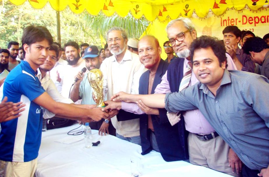 Prof. Dr. AKM Azharul Islam, VC of International Islamic University Chittagong (IIUC) distributing Champion Trophy to Electronic and Telecommunications Engineering Department at the play ground of IIUC permanent campus at Kumira as Chief Guest on Wedne