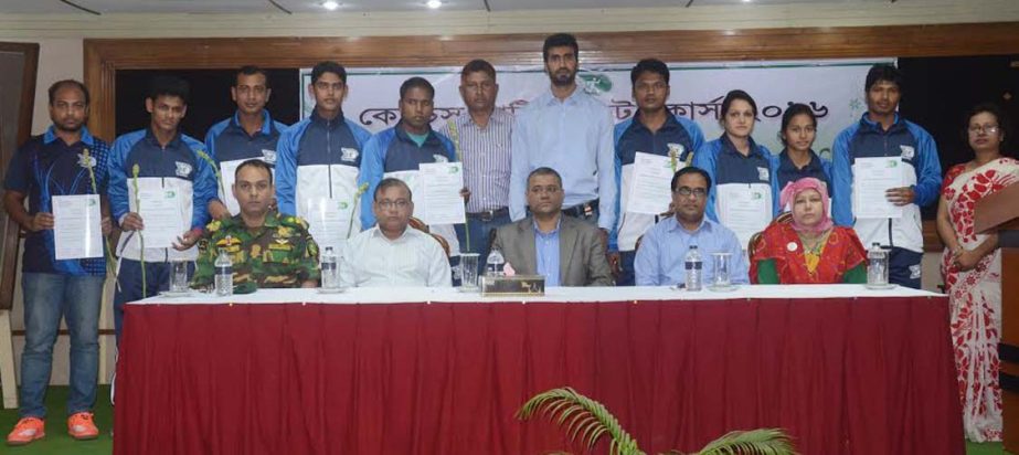 The certificate-earners of the volleyball and archery coaches' course with the chief guest Director General of BKSP Brigadier General Md Shamsur Rahman and the other officials of BKSP pose for photograph at the BKSP in Savar on Thursday.