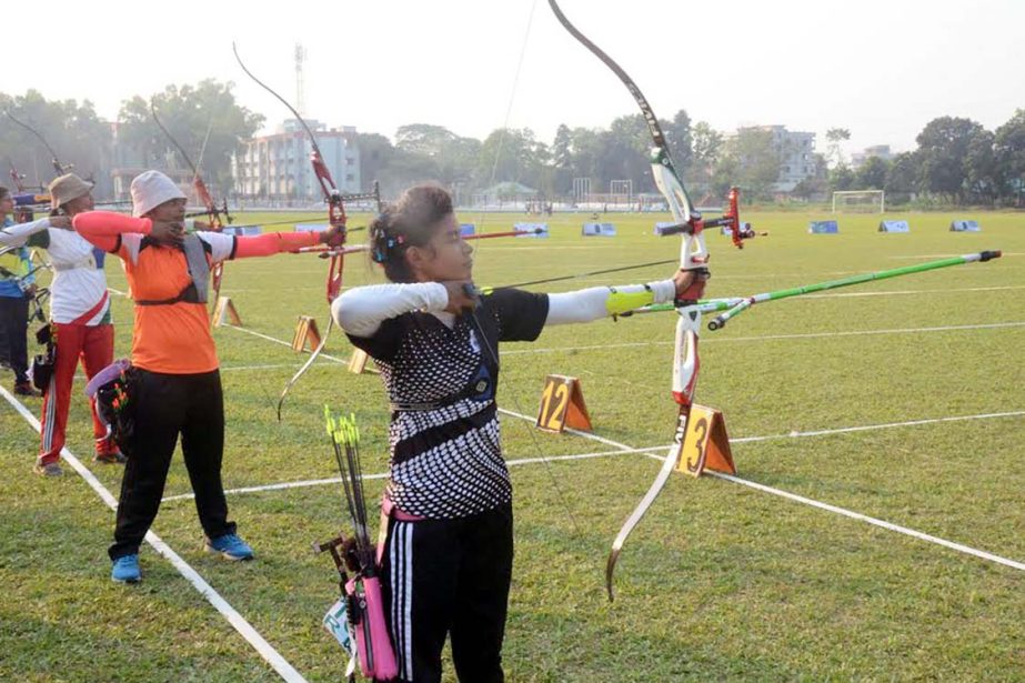 The archers throwing arrow during the First Blazer BD BKSP Cup Archery Championship at the BKSP Football Ground-1 in Savar on Thursday.