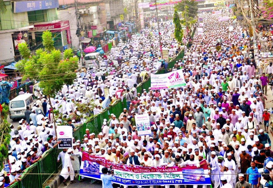 Musallies along with Hefajat-e-Islam men brought out a procession in the city after Jumma prayer protesting killing and oppression of Rohingya Muslims. This photo was taken from in front of Baitul Mukarram National Mosque.
