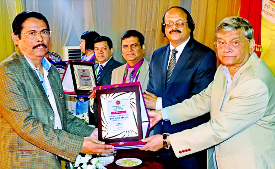 Md. Abdul Mannan, State Minister, Ministry of Finance and Planning, handed over a crest and tax card to Babu Subodh Ranjan Das as the highest tax payer of Narshingdi District recently in the city. Md. Nojibur Rhaman, Chairman of National Board of Revenue