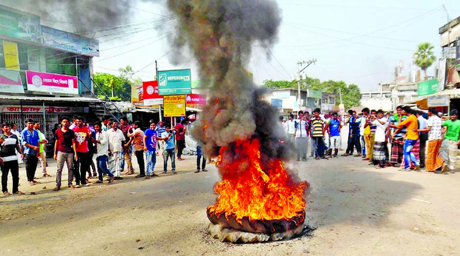Students, teachers and locals staged demonstration and put fresh barricades on the road by setting tyres on fire at Sujanagar Upazila of Pabna district on Monday during day-long hartal demanding nationalization of Nizam Uddin Asgar Ali Degree College.