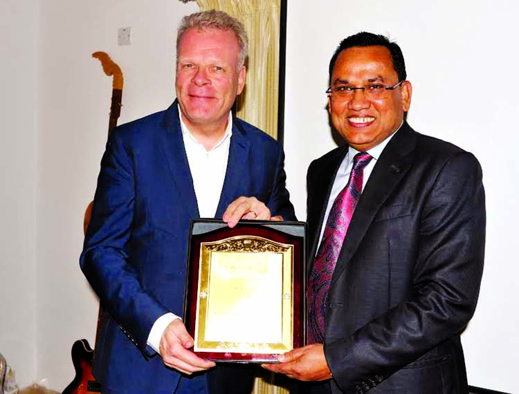 Danish Novozymes awards textile manufacturing contributing to sustainable production in Bangladesh on Monday. From left - Danish Ambassador Mikael Hemniti Winther, Md. Abdul Jab are seen.