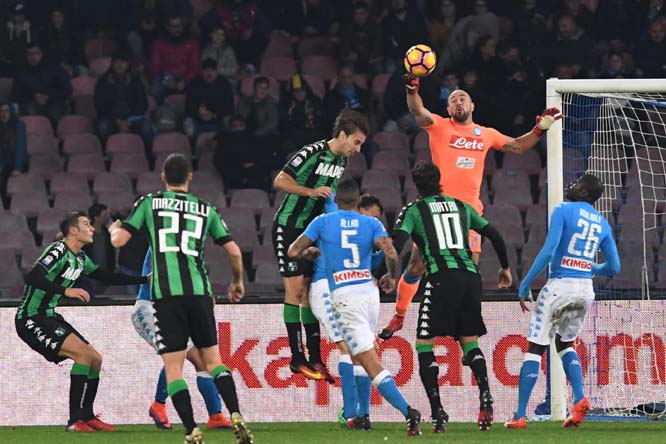 Napoli's goalkeeper Pepe Reina reaches out for the ball during an Italian Serie A soccer match between Napoli and Sassuolo at San Paolo stadium in Naples on Monday.