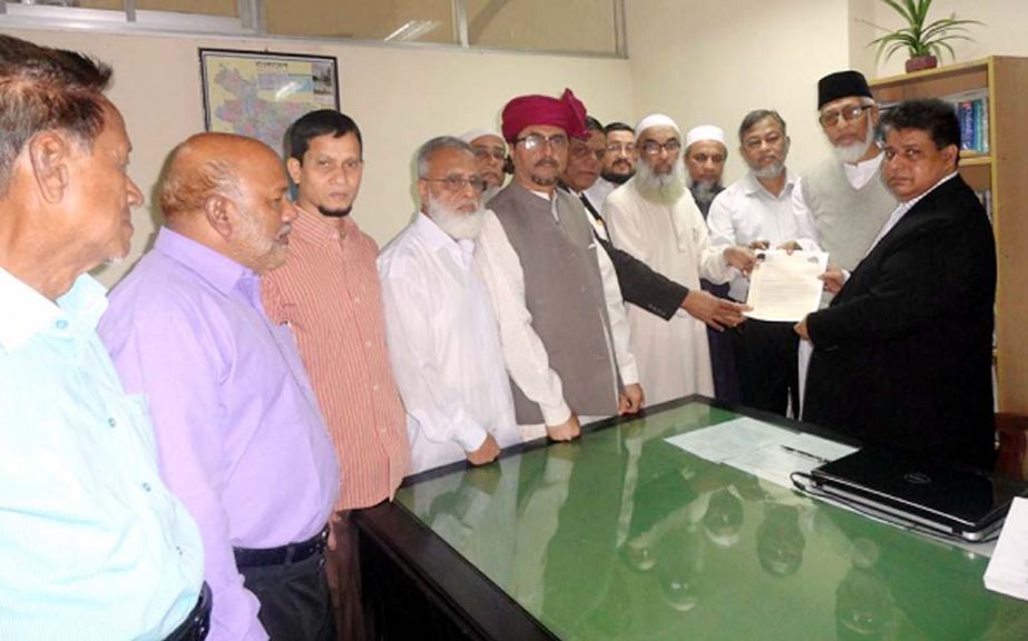 Sankar Ranjan Saha, Additional Divisional Commissioner of Chittagong seen receiving the memorandum from the leaders of Hajj Pilgrims Welfare Council, Chittagong on behalf of the Divisional Commissioner at his office chamber yesterday.