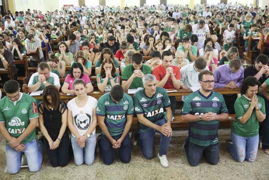 Supporters of Brazil's soccer team Chapecoense attend Mass at the city's Cathedral in Chapeco, Brazil on Tuesday. A chartered plane carrying the Brazilian soccer team Chapecoense to the biggest match of its history crashed into a Colombian hillside and