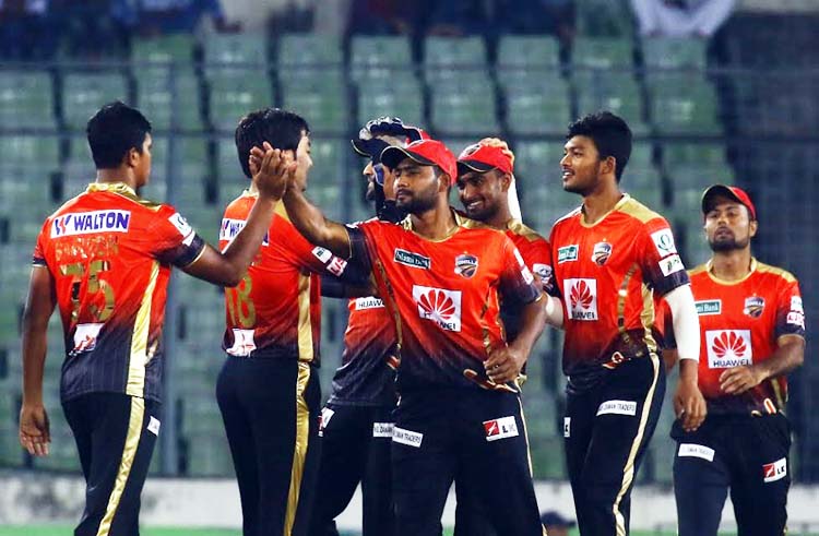 Players of Comilla Victorians celebrate after taking the wicket of Mehedi Hasan Miraz of Rajshahi Kings at the Sher-e-Bangla National Cricket Stadium on Wednesday.