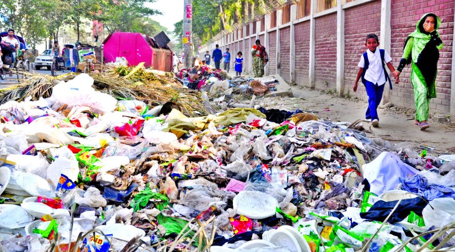 Huge garbage that have been dumped in front of the city's Rajarbag Police Line area creating obstacles to the movement of vehicles as well as exposes the city dwellers due to air pollutions and environmental hazards. This photo was taken on Wednesday.