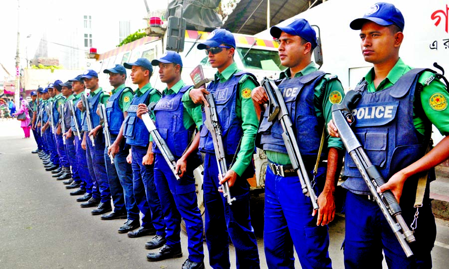 Law enforcers stand guard around the Bangladesh Secretariat for security reasons for the programmes of different organisations. The snap was taken from in front of the Jatiya Press Club on Thursday.