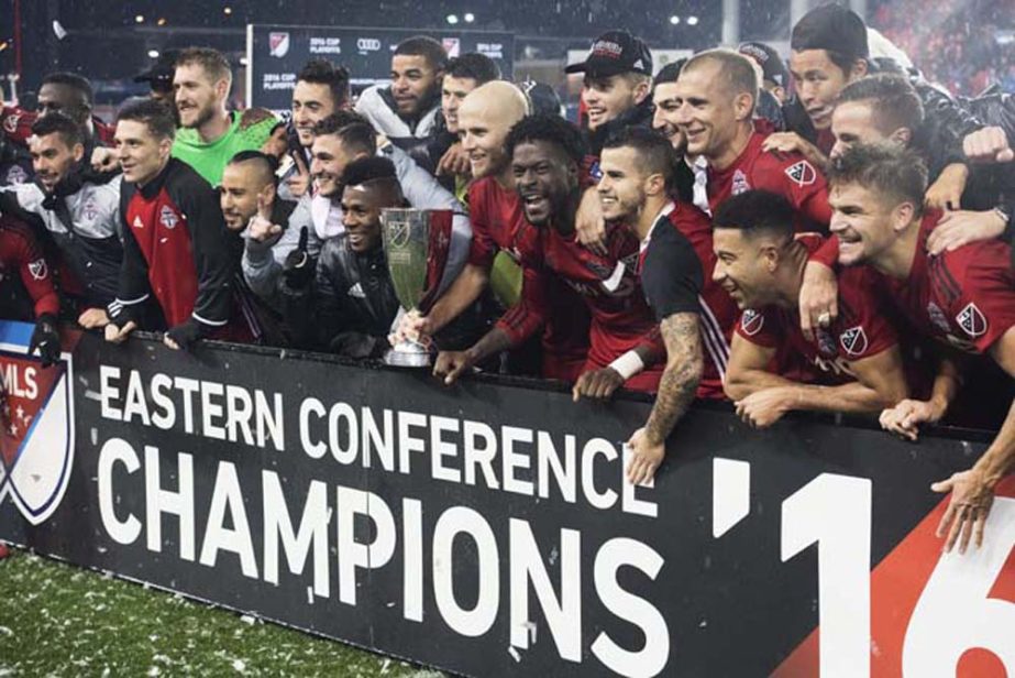 Toronto FC celebrates its victory over the Montreal Impact in the MLS Eastern Conference championship series, in Toronto on Wednesday.