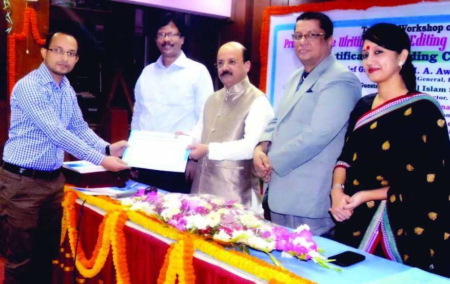 Lion MA Awal, MP seen to distribute certificates among the participants of a training workshop on 'Press release writing, photo editing and media relations' organised recently by BIJEM at its auditorium in the city.