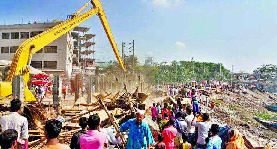 Gazipur City Corporation Authority demolishing illegal structures on the bank of the River Turag for settling up parks. This photo was taken recently.