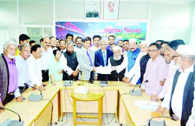 SYLHET: Acting President of Sylhet Awami League Adv Lutfur Rashman submitting nomination paper to the Returning Officer Joynul Abedin on Thursday.