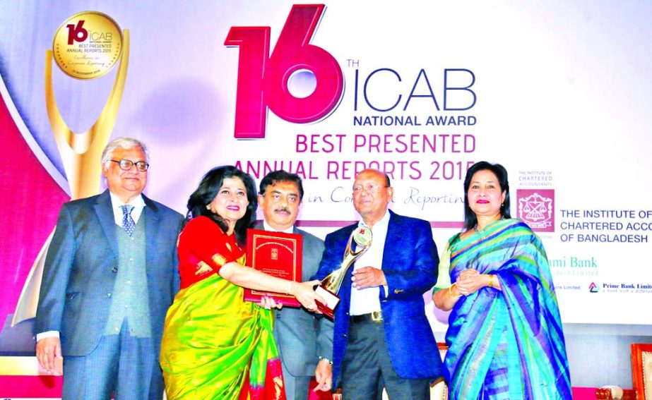 Commerce Minister Tofail Ahmed MP, handling over the 1st prize in the Insurance category in the 16th ICAB National Award Ceremony to Farzana Chowdhury, CEO of Green Delta Insurance Company Limited in the city recently. Senior Executives of the company wer