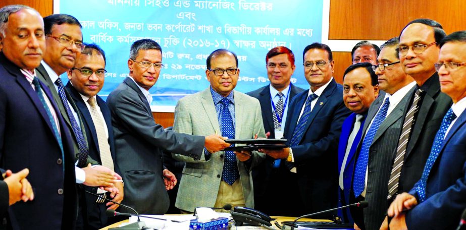 Md Abdus Salam, Managing Director of Janata Bank Ltd, signed a MoU among GMS' of local office, Janata Bhaban Corporate Branch and Divisional offices for achieving annual target of the bank at banks' head Office in the city recently. Md Golam Faruque, Md