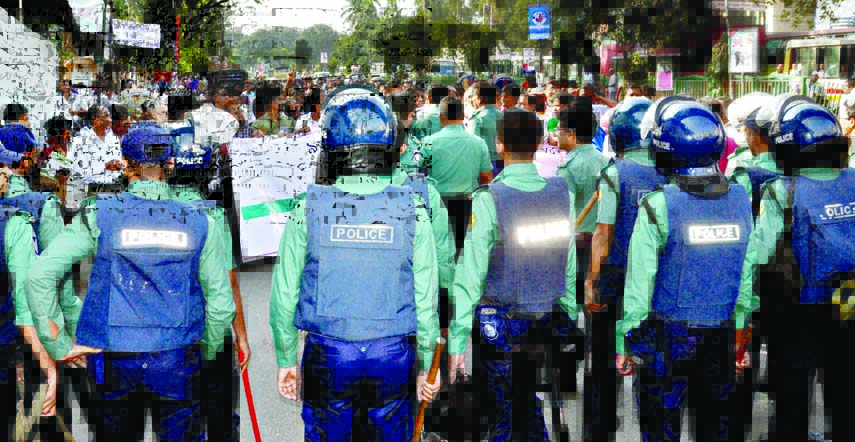 Law enforcers intercepted the procession of Bangladesh Newspapers Employees Federation and Bangladesh Federal Union of Newspaper Press Workers when it was brought out in the city's Topkhana Road on Sunday demanding immediate announcement of the 9th wage