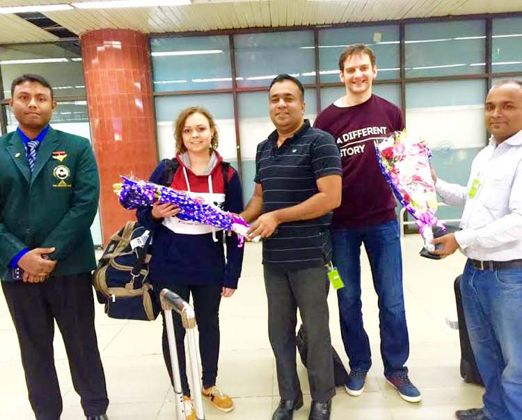 The officials of Sheikh Russel Memorial Sporting Club receiving the two Super Grand Masters with bouquet at the Hazrat Shahjalal International Airport on Sunday.