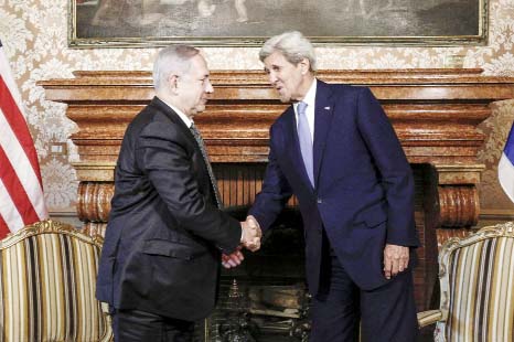US Secretary of State John Kerry shakes hands with Israeli Prime Minister Benjamin Netanyahu in Rome, Italy