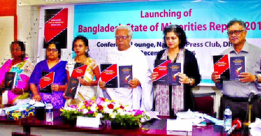 Columnist Syed Abul Maksud along with other distinguished persons holds the copies of a report titled 'Bangladesh State of Minorities' at its cover unwrapping ceremony organised by Nagorik Udyog at the Jatiya Press Club on Monday.