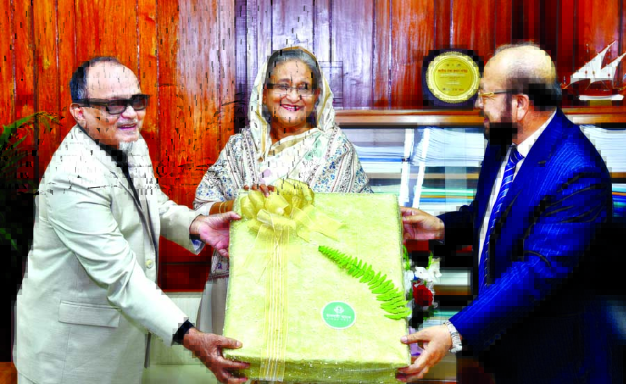 Entrepreneurs of NRB Global Bank and Islami Bank Limited handing over blankets for the cold-stricken people to Prime Minister Sheikh Hasina at the latter's office of the Jatiya Sangsad Bhaban on Monday. BSS photo