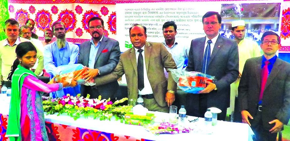 Shah Syed Abdul Bari, Deputy Managing Director of National Bank Limited (NBL) recently distributed school dresses among students of two schools of Devigonj upzela under Panchagarh District under its CSR activities. High officials of NBL and local elites w