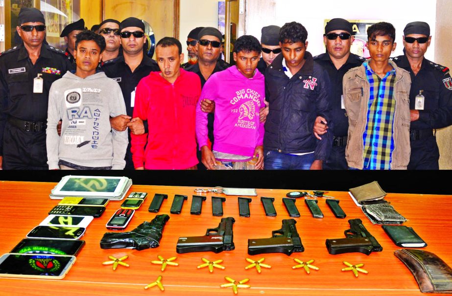 RAB arrested five alleged arms traders from city's Badda and Uttara areas on Sunday night with arms from their possessions.