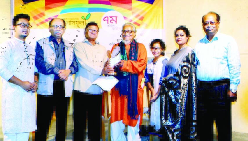 Prof. Abul Kashem Fazlul Haque handing over a Crest of Honour 2015 to Poet Asad Choudhury in an Adda of Poems organized on the occasion of 7th Anniversary of Ghasful, a media house on Sunday evening at the open premises of Sanskriti Bikash Kendro. Poet Ha