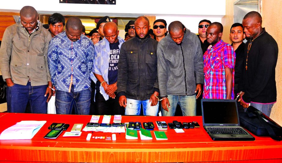 RAB members nabbed eight people, including seven Nigerians of a fraud gang, from the city's Mirpur and Dakkhin Khan areas on Tuesday for allegedly deceiving people through mobile phone calls.