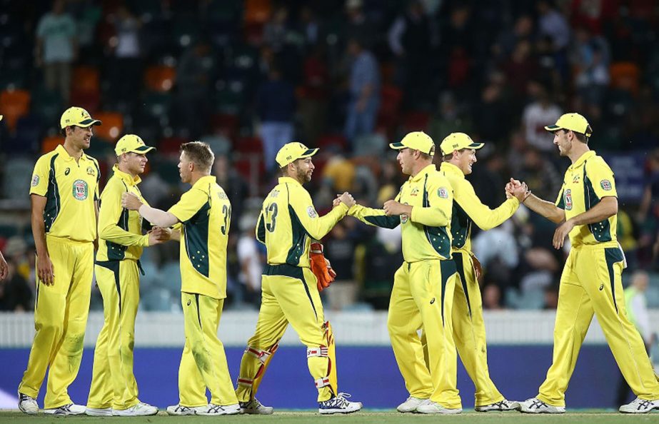Australian players celebrate victory in game two of the One Day International series between Australia and New Zealand at Manuka Oval in Canberra, Australia on Tuesday.