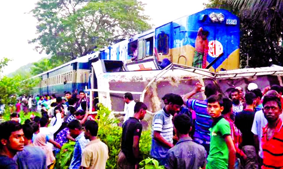 A train rammed into a passenger bus at Ijjatpur level-crossing in Sreepur Upazila of Gazipur district injuring four people on Tuesday.