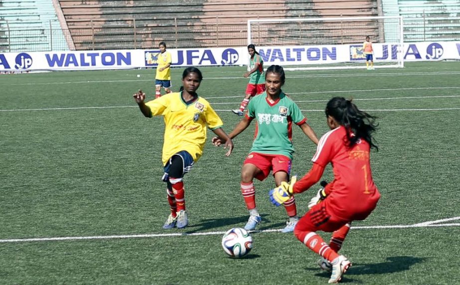 An action from the match of the JFA National Women's Under-14 Championship between Thakurgaon district team and Satkhira district team at the Bir Shreshtha Shaheed Sepoy Mohammad Mostafa Kamal Stadium in Kamalapur on Wednesday.